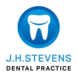 J.H Stevens Dentist Logo of tooth in a blue circle background - Weston super Mare